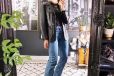 a trendy look with a black tee, a black leather blazer, blue jeans, black booties for spring