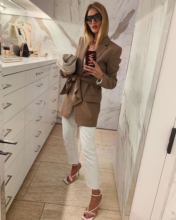 a white top, jeans, square toe heels, a camel long blazer for a chic spring work look