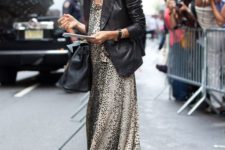 an animal print maxi dress, a black leather blazer and a black bag for a trendy and bold look