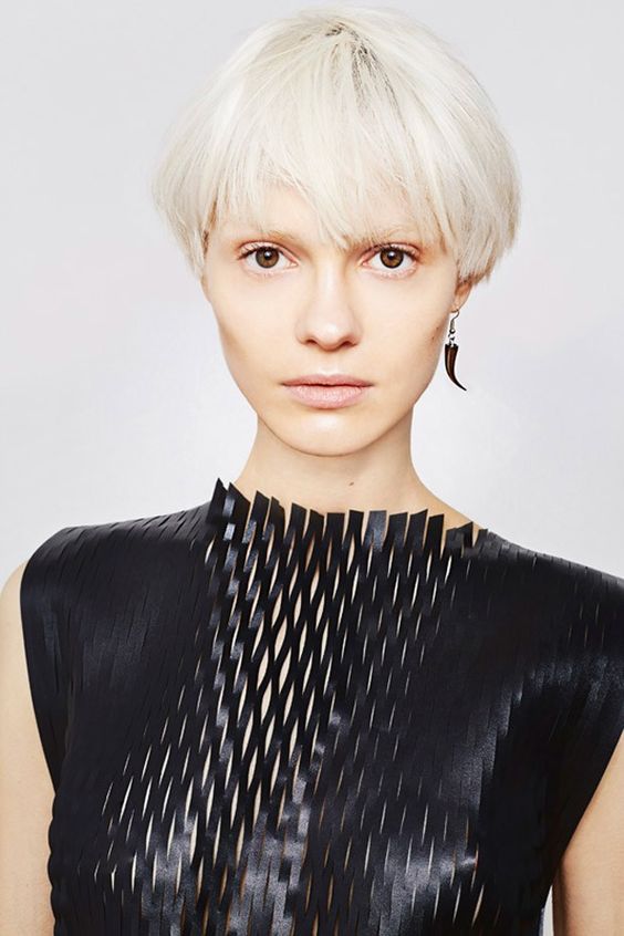 an icy blonde bowl haircut with much texture and enough volume is a cool modern idea