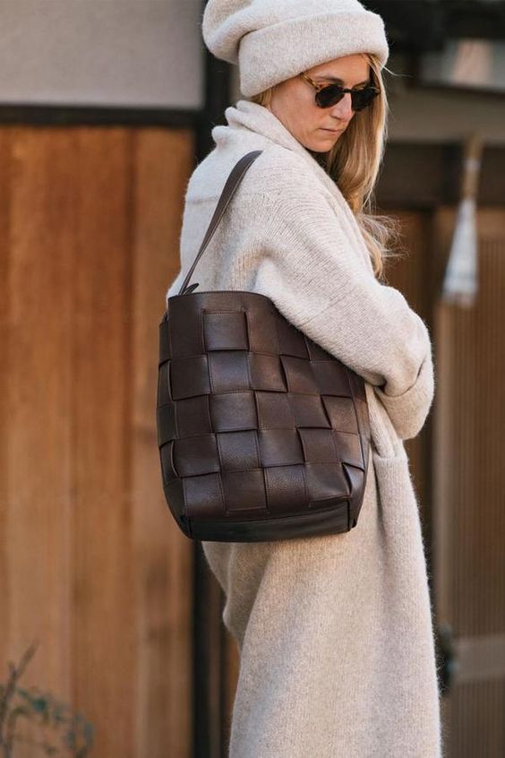 finish off your look with a chocolate brown woven leather bucket bag, which is two trends in one