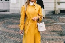 wear your bright trench with trainers and a simple bag not to distract attention from your bold clothes item