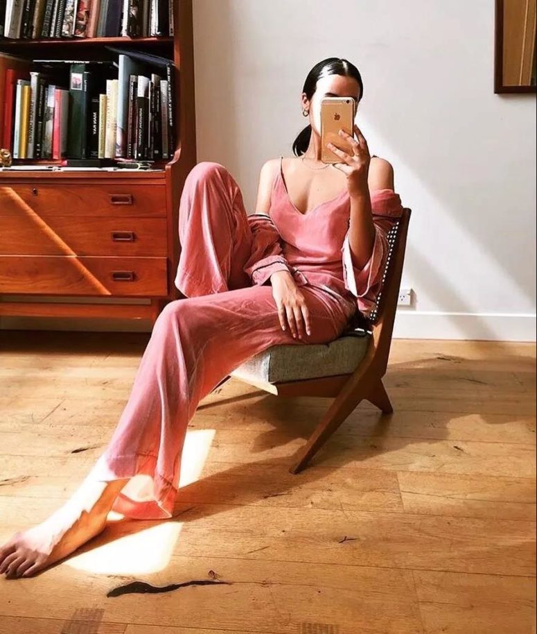 a bright pink pajamas set with a spaghetti strap top, pants and a duster for a chilly day