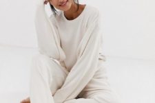 10 a white thin knit homewear suit with an oversized long sleeve top and pants is perfect for now