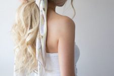 15 a low ponytail with waves and locks down accented with a colorful hair tie is a nice idea for a girlish touch
