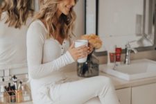 16 white pajamas with a long sleeve top on buttons and joggers look chic, bright and very stylish