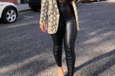 With black lace top, black leather pants and shoes