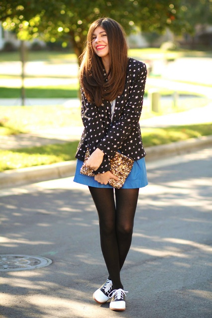 With blue skirt, golden clutch, black and white shoes and shirt