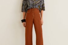 With brown cropped trousers and brown mules