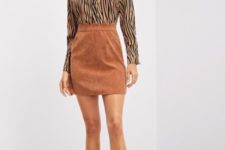 With brown suede high-waisted mini skirt and black patent leather ankle boots
