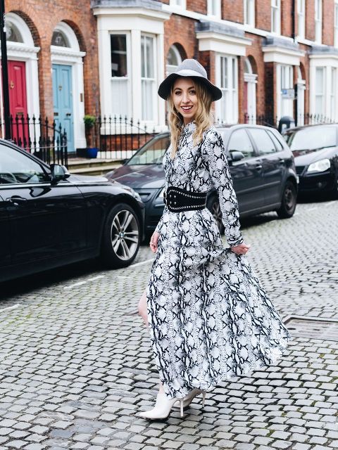 With gray hat, embellished belt and white heeled boots