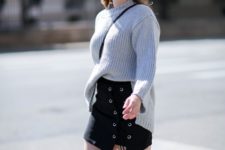 With gray oversized sweater, crossbody bag and high heels