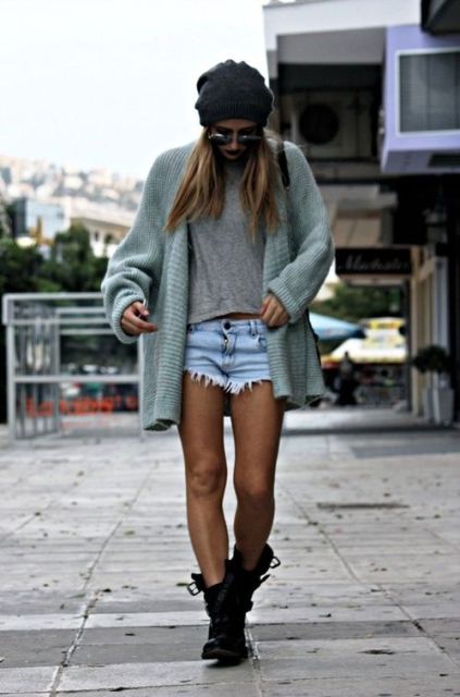 With gray t-shirt, mint green cardigan, hat and denim shorts