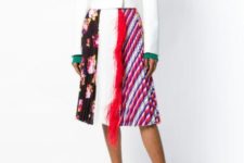 With green shirt, printed pleated skirt and white sneakers