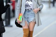 With labeled t-shirt, denim shorts, gray blazer and bag