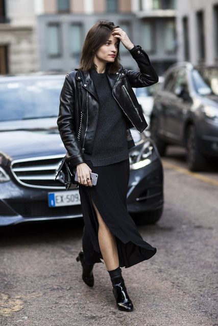 With sweater, black leather jacket, chain strap bag and patent leather boots