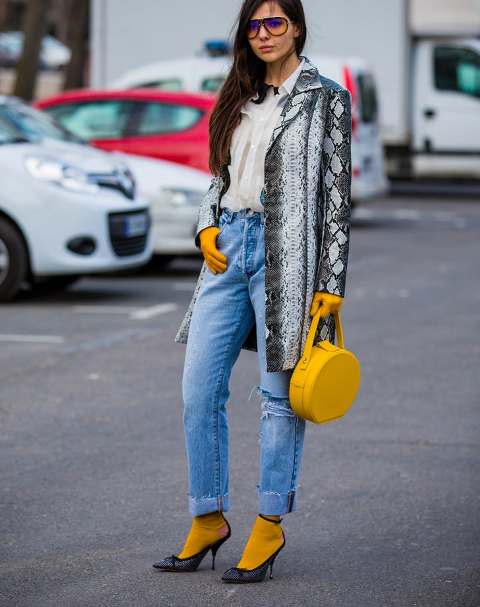 With white blouse, jeans, yellow socks, yellow rounded bag, gloves and shoes