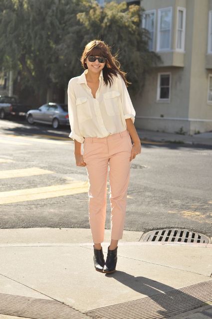 With white loose button down shirt and black ankle boots