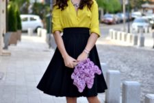 With yellow shirt and brown lace up high heels