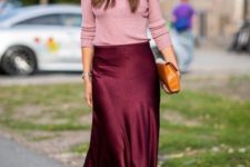 a burgundy slip skirt, a pink top, a brown clutch and two tone shoes for a spring or fall look