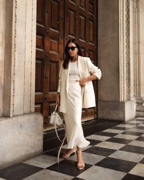 a classy neutral spring outfit with a tank top, a satin maxi skirt, a creamy blazer, white shoes and a small bag