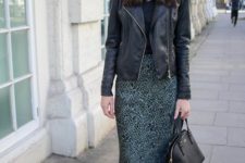 a dark look with a black tee, a green animal print slip skirt, black booties, a black leather jacket and a bag