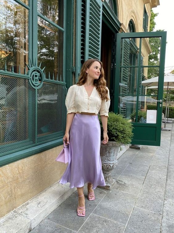 a delicate spring look with an ivory cropped blouse, a lilac satin midi, pink lace up shoes and a lilac bag is creative
