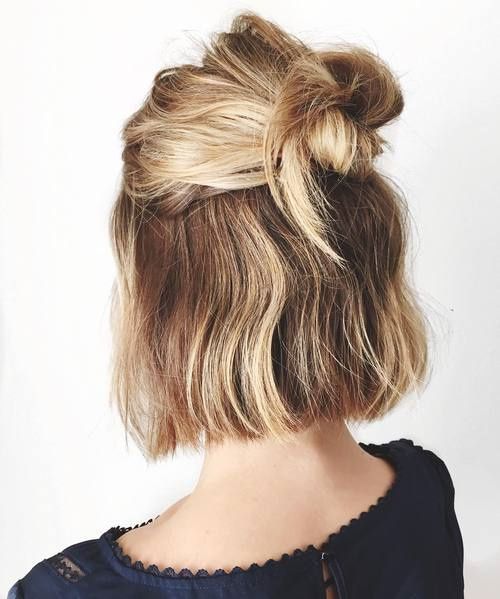 a messy half updo with knotted hair and a messy bump on top is a stylish hairstyle idea to try