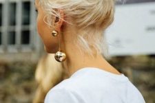 a messy midi bun with a messy top is always a cool idea if you can secure you hair like this