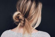 a messy undone bun with a sleek top is a cool hairstyle to keep your hair off the face, and you can make it fast