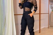 a party look with a crop top, a sheer blouse, two tone shoes and black cargo pants for a wow effect