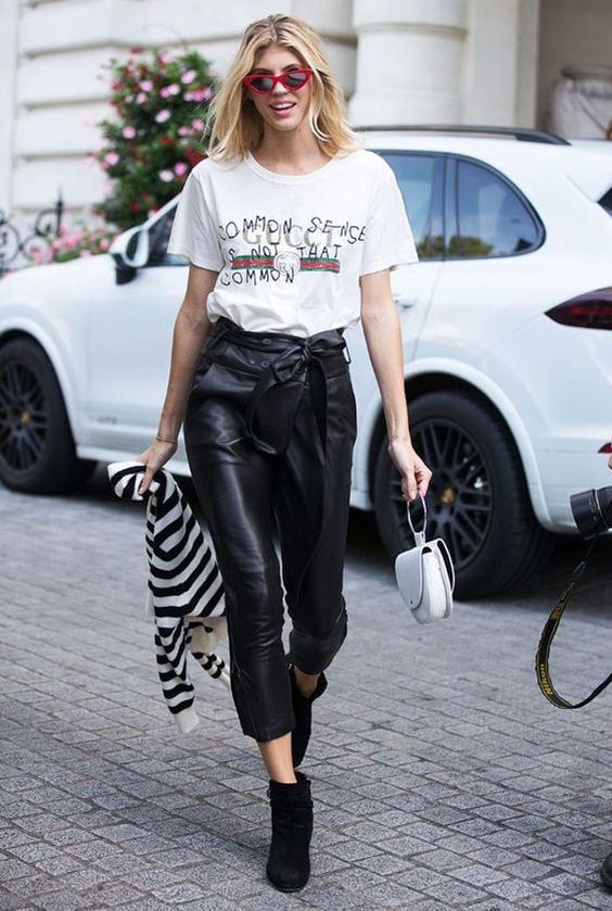 a printed tee, black cropped high waisted pants, black suede booties and a striped cardigan