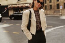a refined outfit with black pants, a printed top, a white cropped blazer, a black bag