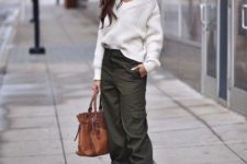 a spring look with a white one shoulder sweater, green cargo pants, animal print shoes and a brown bag