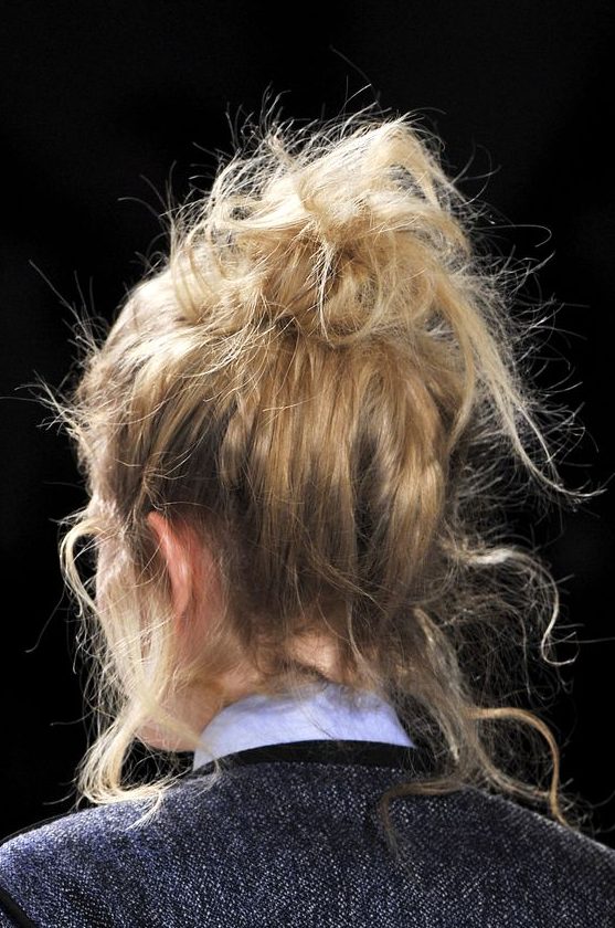 a super messy top knot with a lot of textured hair down is always a good idea that can be realized on the go