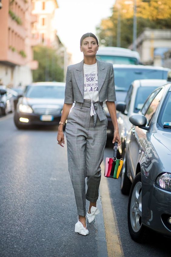 a trendy look with a grey plaid suit with a cropped blazer, white bow shoes and a printed tee