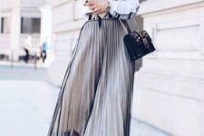 a white printed shirt, a white pleated midi skirt, a sheer black overskirt, black shoes and a bag