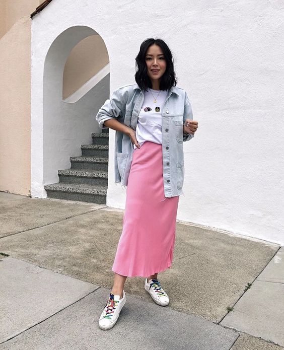 a white tee, a pink satin midi skirt, neutral sneakers and colorful laces, a bleach denim oversized jacket for spring