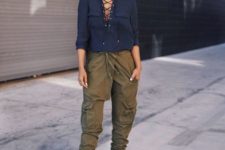green cargo pants, a navy lace up blouse and tan heels for a bold spring look