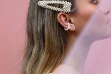statement pearl hair clips paired with a matching ear cuff for a bold contemporary look