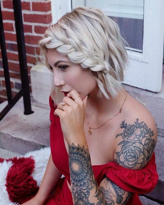 short wavy icy blonde hair with a single side braid for a bolder and boho touch to your look