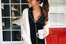 11 black silk pajamas with white edging and a white cardigan over it for a classic and timeless look