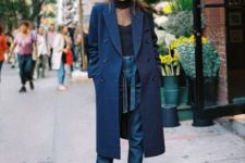 With black blouse, belted jeans and navy blue midi coat