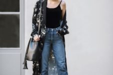 With black top, black leather bag, distressed jeans and yellow sandals