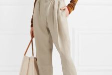 With brown turtleneck, tote bag and transparent shoes