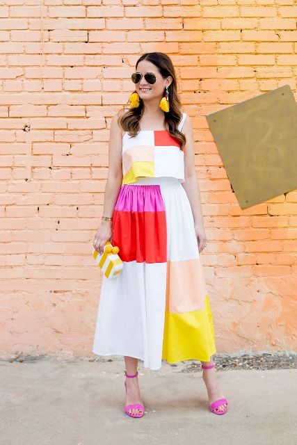 With color block top, sunglasses, yellow and white clutch and pink shoes