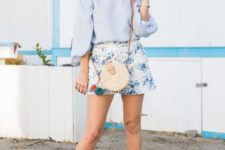 With floral shorts, hat, crossbody rounded bag and white flat sandals