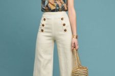 With floral top, golden bag and brown shoes