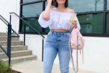 With jeans, pale pink backpack and yellow sandals