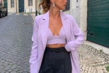With lilac loose blazer, black trousers and bag